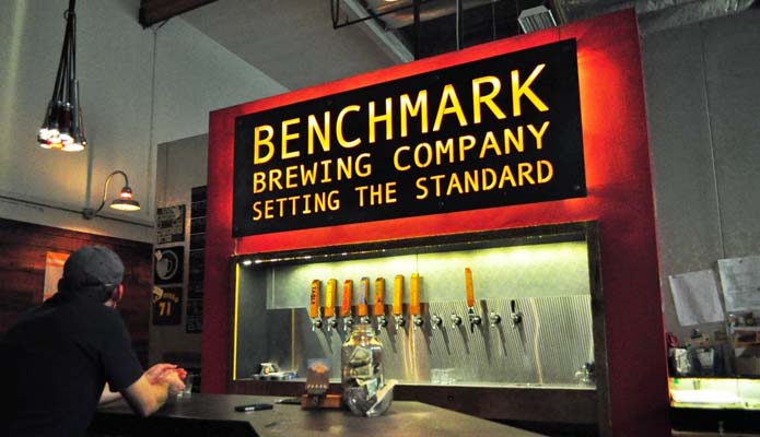 man at benchmark brewing tasting room