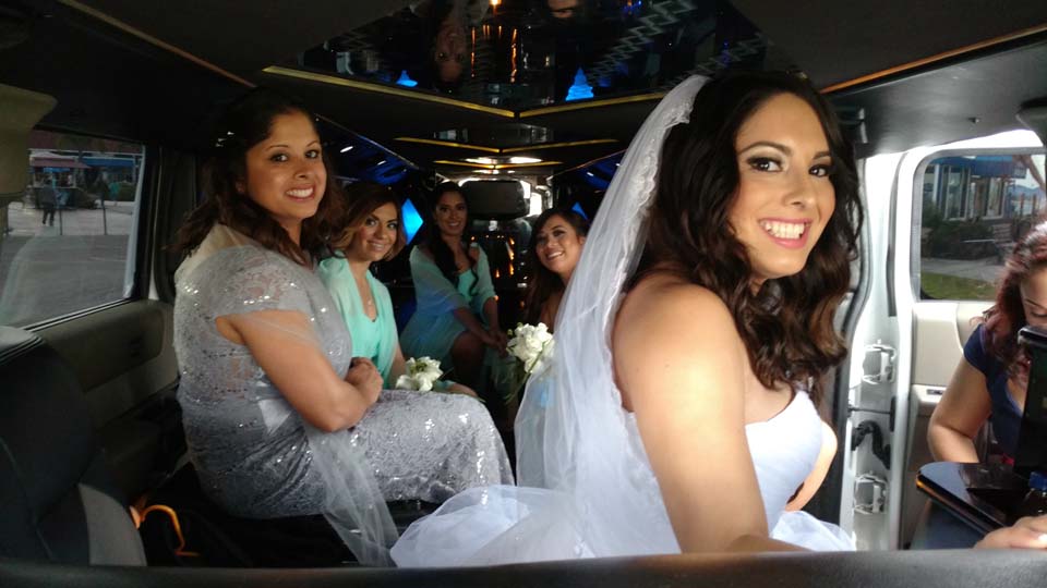 bride in white gown with her attendants