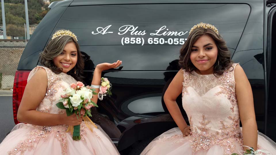 twin sisters with limousine on their 15th birthdays