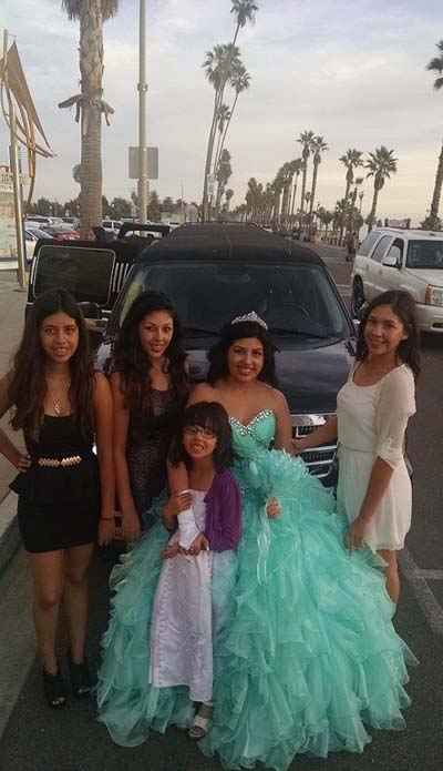 Five young latinas standing next to A Plus Limo