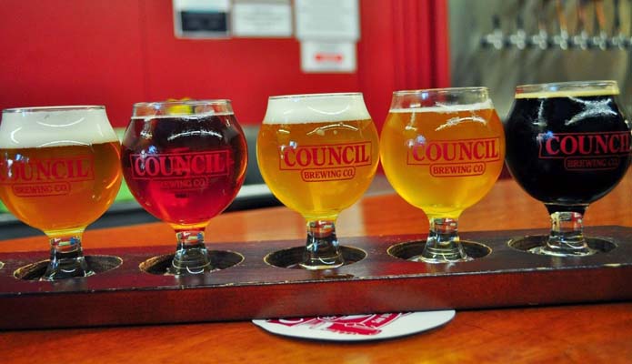five sampler glasses of beer from council brewing in San Diego
