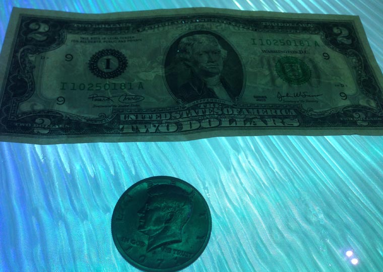 2 dollar bill and half dollar