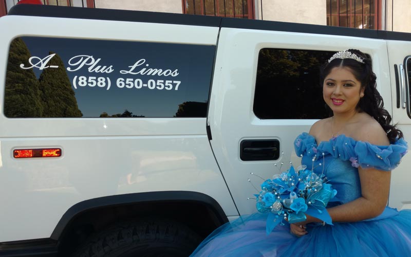 young-woman-in-blue-dress-with-white-hummer-limo-in-san-diego