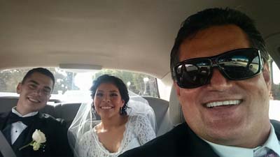 chauffeur with newly married couple