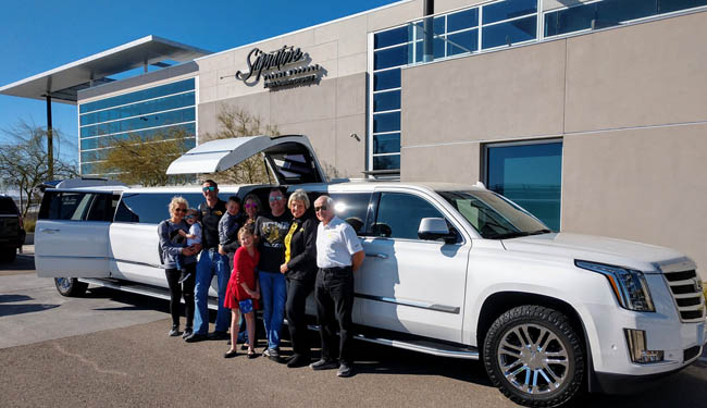 family with white limousine at san diego international airport private jet terminal landmark aviation signature